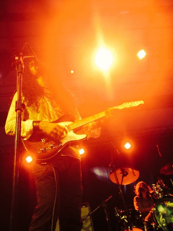 Nicolas performing on a brightly lit stage