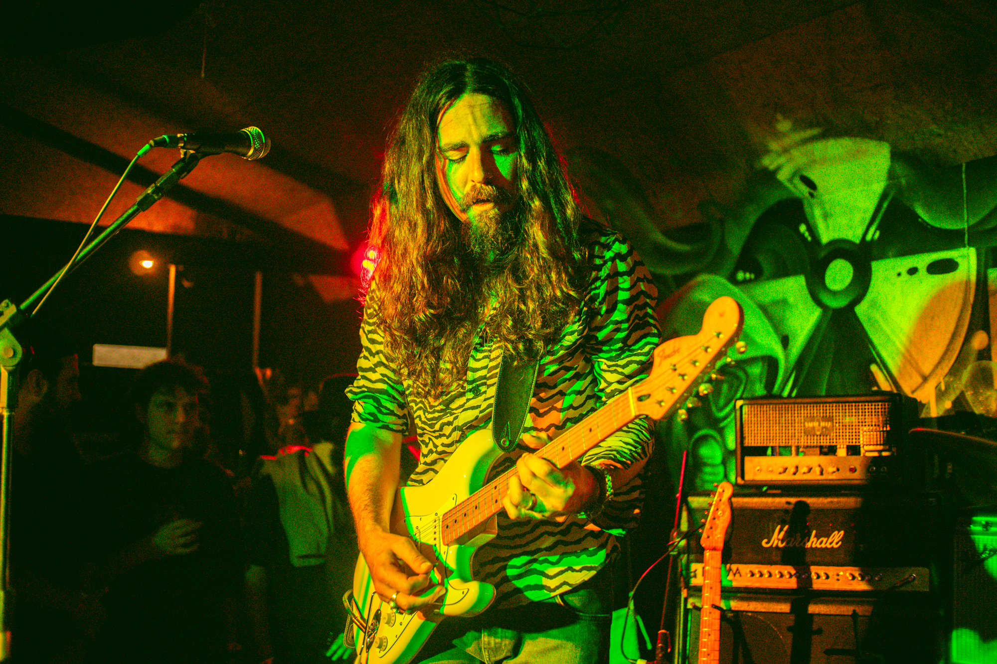 Nicolas performing with a guitar and Marshall amplifiers